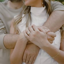 An engaged couple with a wedding ring