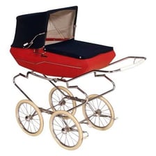 A classic pram used to carry a baby