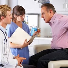 A doctor applying medical treatment to a patient.