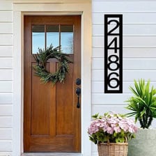 A house front displaying its street address.