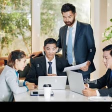 People discussing a topic around a meeting table