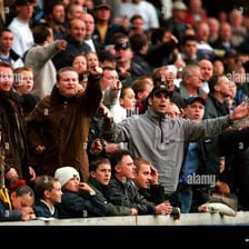 An agitated crowd at a football match.