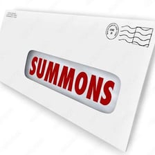 A legal summons document.