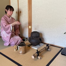A participant performing a traditional Japanese tea ceremony