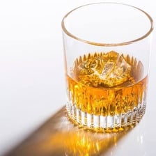 A small measure of whisky in a glass