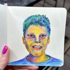 A coloured wax crayon used for drawing
