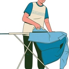 A person using an ironing board to press clothes.