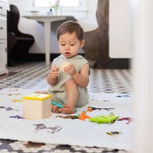 A toddler playing indoors