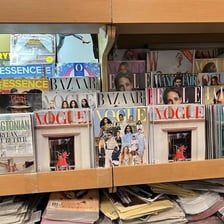 A printed magazine displayed on a newsstand