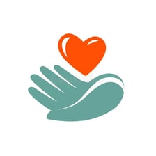 Hands passing a donation to represent charitable aid.