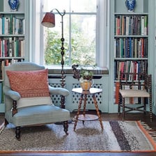 A quiet home study or den with books and a desk