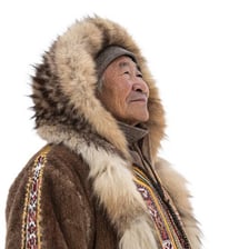 An Inuit person wearing warm traditional Arctic clothing.