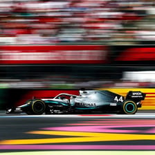 Formula 1 cars competing on a racetrack