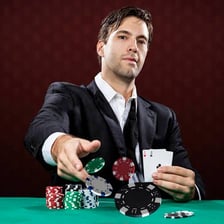 Poker chips placed in the center of a table before cards are dealt