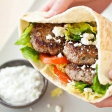A Greek gyro served in pita with meat and toppings