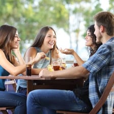 Two friends talking together outdoors