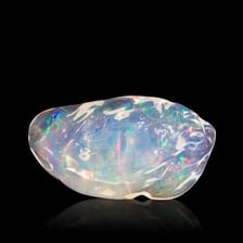 A polished opal showing colorful iridescent flashes.