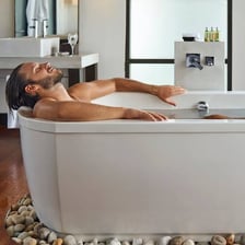 A bathtub prepared for someone to take a bath.