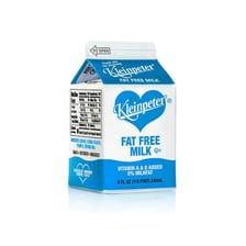 A carton labeled skim milk