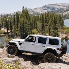 A Jeep Wrangler on an off-road trail.