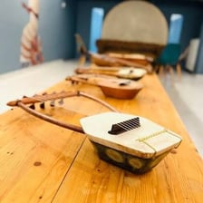 An ancient Greek lyre displayed as a historical musical instrument.