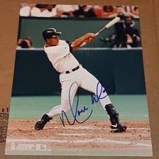 Moisés Alou wearing a Houston Astros baseball uniform.