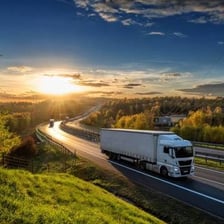 A large tractor-trailer truck traveling on a highway.