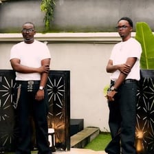 Two brothers standing together outdoors