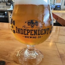 A pint of craft beer served in a brewery.
