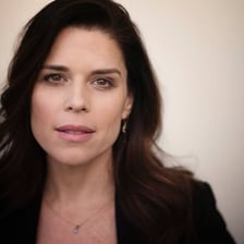 A portrait of actress Neve Campbell.