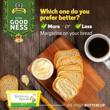 Margarine spread on bread beside a dish of the spread.