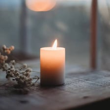 A lit candle used to remember someone who has died.