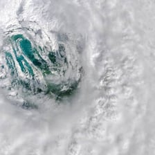 A satellite view showing the distinct eye at the center of a hurricane