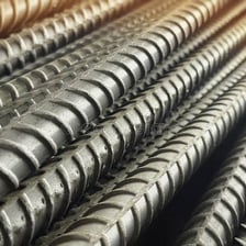 A solid iron bar showing the dark gray appearance of the metal