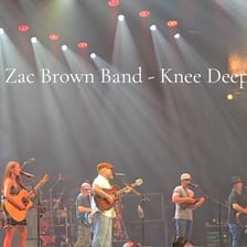 Zac Brown Band and Jimmy Buffett performing the song “Knee Deep.”