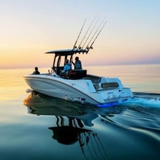 A recreational boat floating on a body of water.