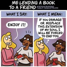 One person handing a book to another person to borrow.