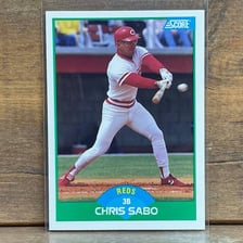 A baseball card showing Chris Sabo in a Cincinnati Reds uniform.