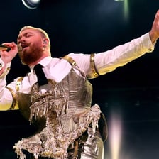 Singer Sam Smith performing on stage.