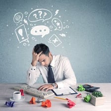 A person looking confused while reviewing an apparent mistake.