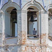 A church bell ringing in a bell tower.