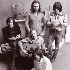 Crosby, Stills, Nash & Young performing together.