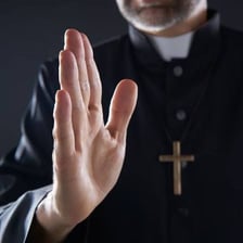 A religious figure giving a blessing.