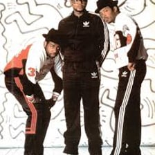 The hip-hop group Run-DMC performing onstage.