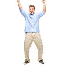 A person cheering with raised arms during a celebration.