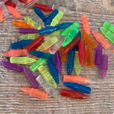 A colorful translucent peg from a Lite-Brite toy