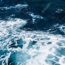 Water churned into a visibly turbulent surface.