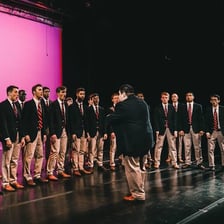 A student vocal ensemble singing together.