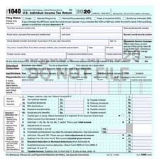 A person preparing documents for a federal income tax filing