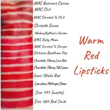 Several lipstick swatches in different shades of red.